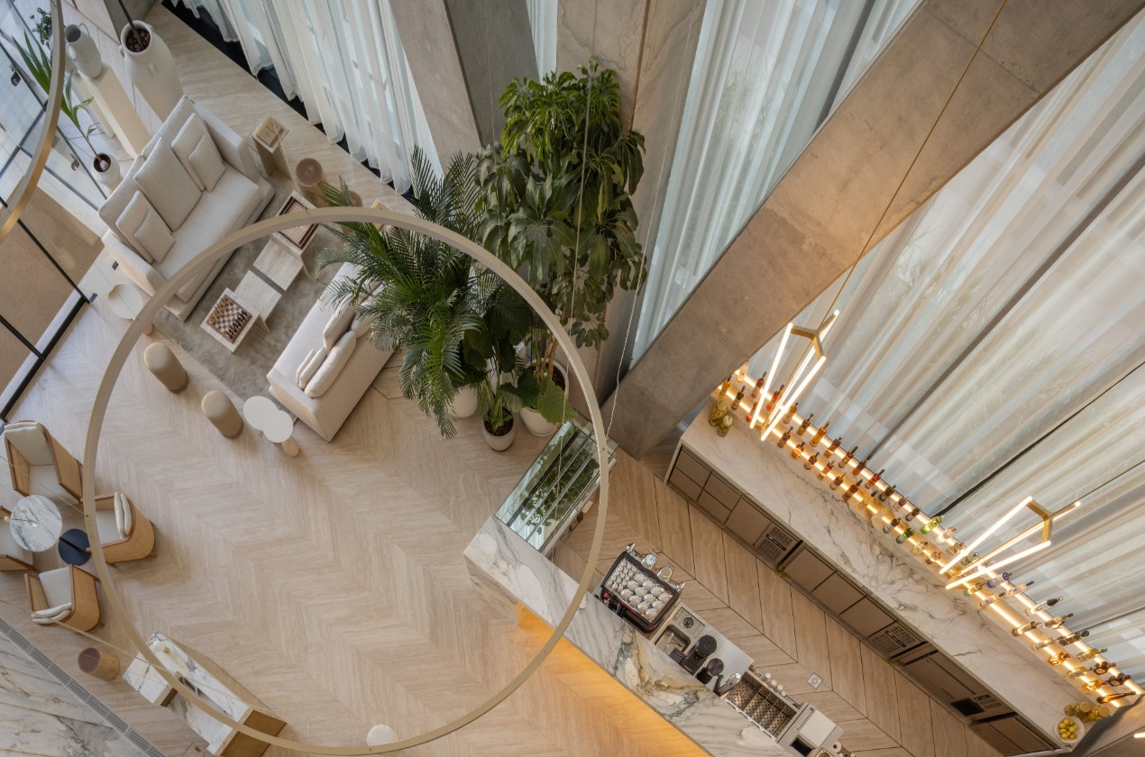 Double-height interior and shared amenity space inside Labs Tower