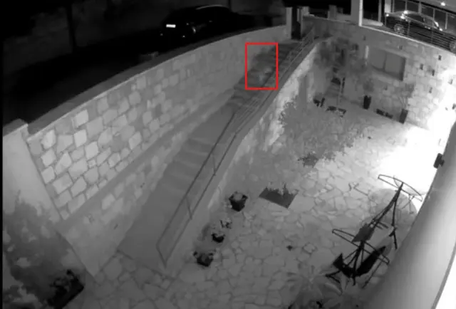 Night-vision footage showing the suspect exiting the property
