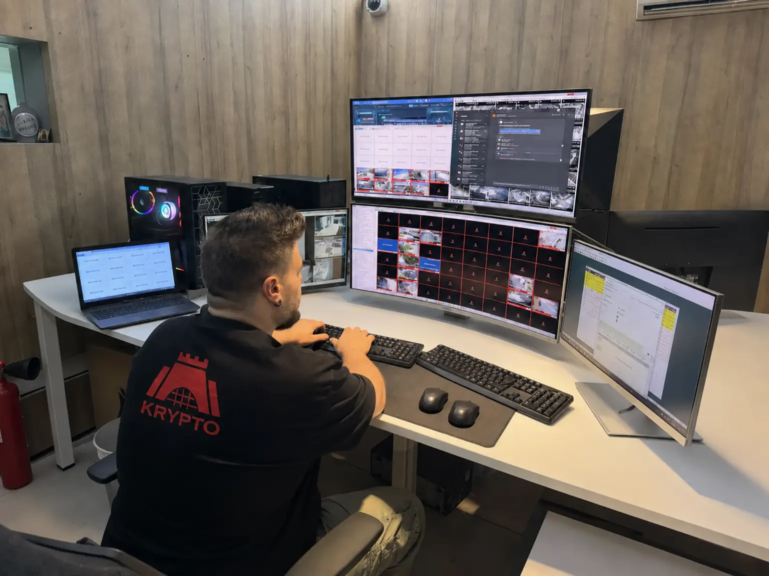 Alexandros Kyriakou monitoring live security systems in the Krypto Monitoring Operating Centre